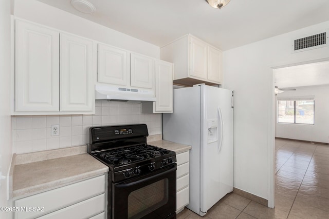 1111 E Lester St, Tucson, AZ 85719 - kitchen featuring black range with gas cooktop, under cabinet range hood, white fridge with ice dispenser, light tile patterned flooring, and white cabinetry