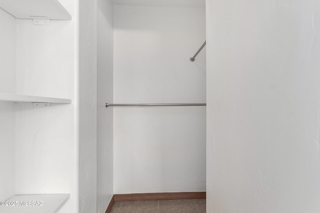 1111 E Lester St, Tucson, AZ 85719 - walk in closet featuring tile patterned flooring