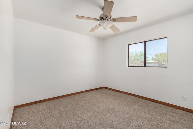 1111 E Lester St, Tucson, AZ 85719 - spare room featuring carpet flooring, baseboards, and a ceiling fan