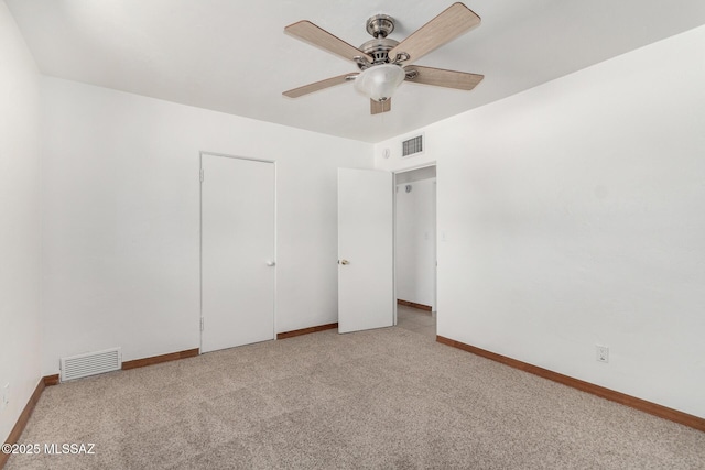 1111 E Lester St, Tucson, AZ 85719 - unfurnished bedroom with carpet, baseboards, and a ceiling fan