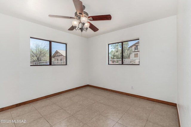 1111 E Lester St, Tucson, AZ 85719 - empty room with baseboards and a ceiling fan