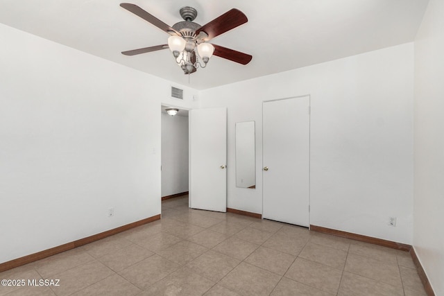 1111 E Lester St, Tucson, AZ 85719 - unfurnished room with a ceiling fan, baseboards, and light tile patterned floors