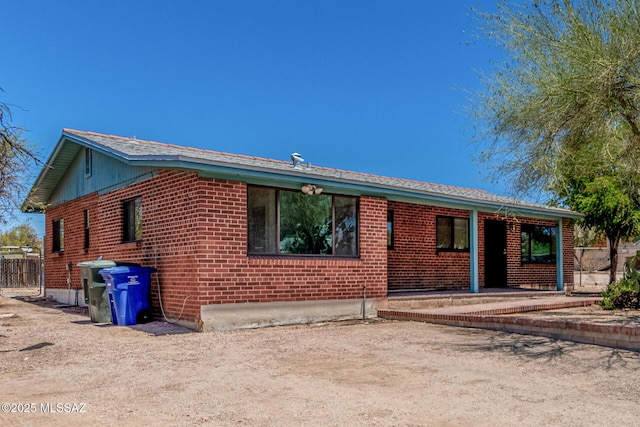 1111 E Lester St, Tucson, AZ 85719 - ranch-style house with brick siding and a patio