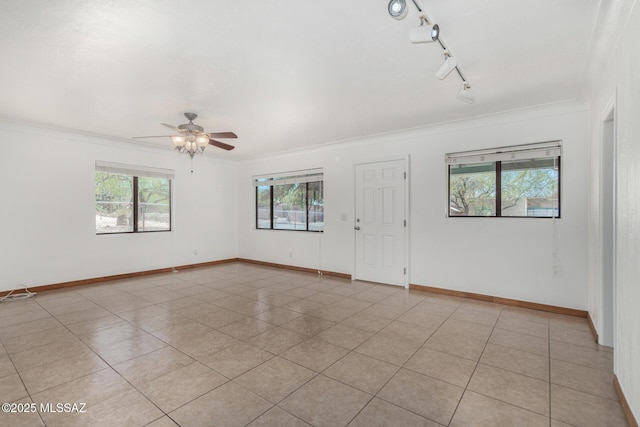 1111 E Lester St, Tucson, AZ 85719 - empty room with ceiling fan, ornamental molding, light tile patterned flooring, and baseboards