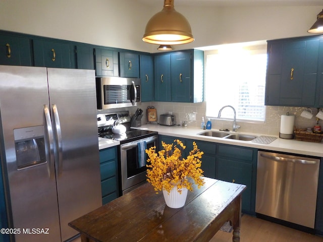 1771 S Desert Vista Dr, Tucson, AZ 85748 - kitchen with appliances with stainless steel finishes, a sink, blue cabinets, decorative backsplash, and light countertops