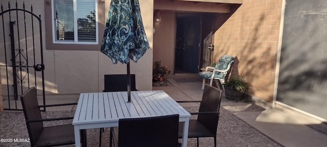 1771 S Desert Vista Dr, Tucson, AZ 85748 - view of patio featuring outdoor dining area and a gate