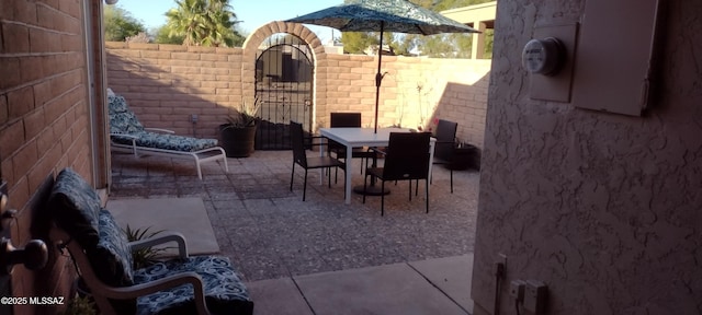 1771 S Desert Vista Dr, Tucson, AZ 85748 - view of patio / terrace with a gate and outdoor dining space