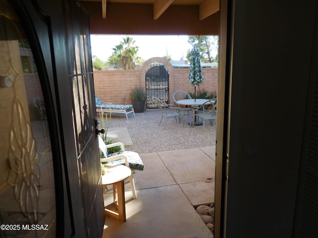 1771 S Desert Vista Dr, Tucson, AZ 85748 - view of patio with outdoor dining area and a gate