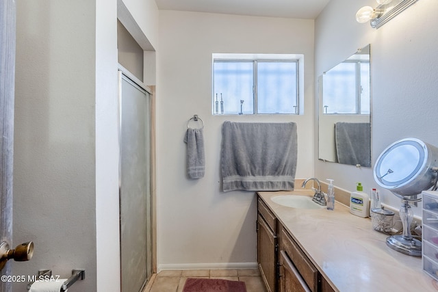 3090 W Alaska St, Tucson, AZ 85746 - full bathroom featuring vanity, tile patterned flooring, a stall shower, and baseboards