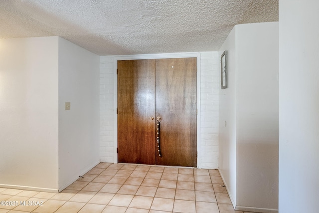 3090 W Alaska St, Tucson, AZ 85746 - foyer featuring a textured ceiling and light tile patterned floors