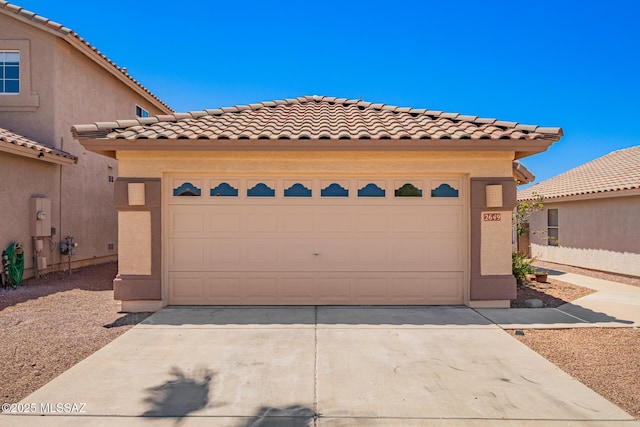 2649 W Catalina View Dr, Tucson, AZ 85742 - mediterranean / spanish-style house with a tile roof, driveway, stucco siding, and a garage