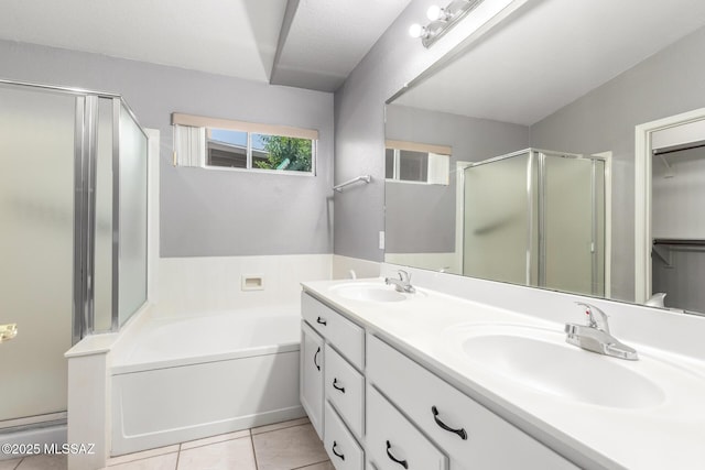2649 W Catalina View Dr, Tucson, AZ 85742 - bathroom with a shower stall, double vanity, a bath, tile patterned floors, and a walk in closet