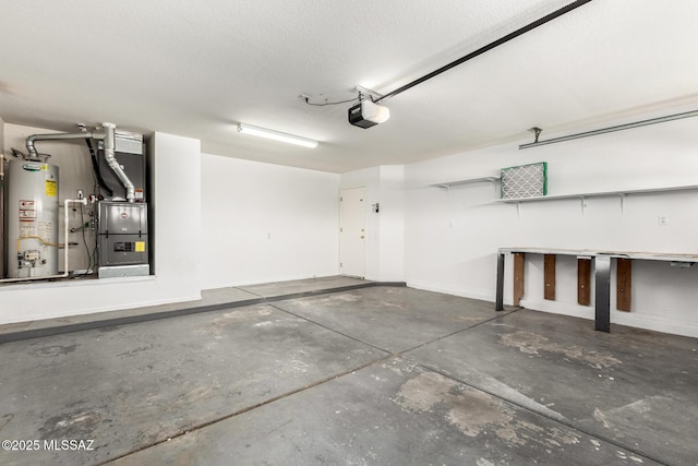 2649 W Catalina View Dr, Tucson, AZ 85742 - garage with gas water heater, heating unit, a garage door opener, and baseboards