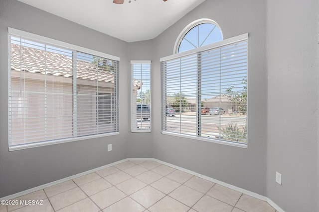 2649 W Catalina View Dr, Tucson, AZ 85742 - unfurnished room featuring ceiling fan, baseboards, light tile patterned flooring, and lofted ceiling