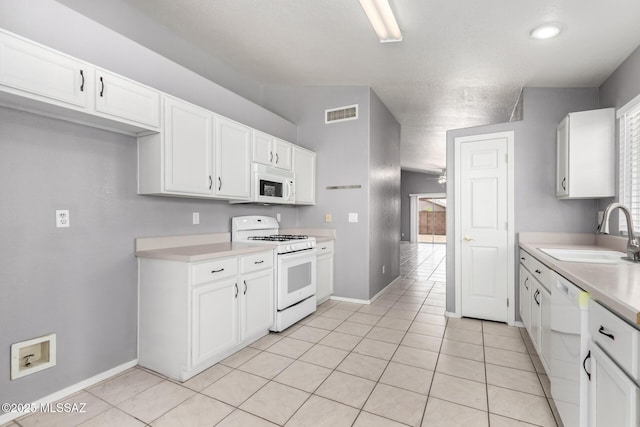 2649 W Catalina View Dr, Tucson, AZ 85742 - kitchen featuring white appliances, a sink, light countertops, and white cabinets