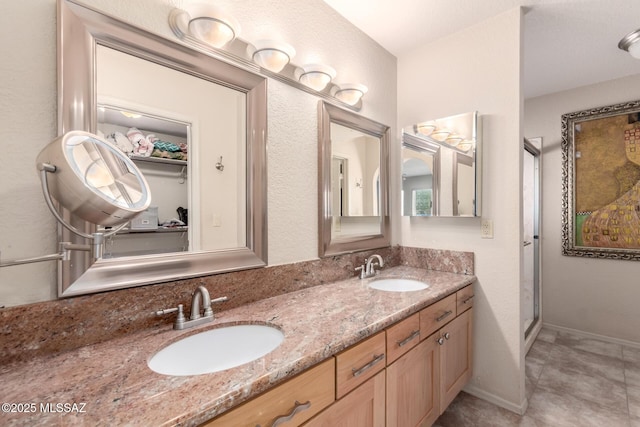 3740 W Placita Fantasia, Tucson, AZ 85745 - bathroom featuring double vanity, a shower stall, and tile patterned floors