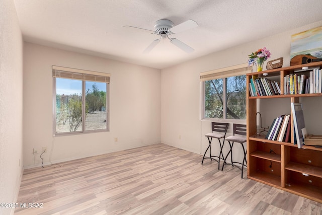 3740 W Placita Fantasia, Tucson, AZ 85745 - living area with wood finished floors and a ceiling fan