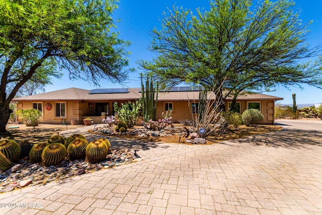 3740 W Placita Fantasia, Tucson, AZ 85745 - single story home with solar panels and decorative driveway