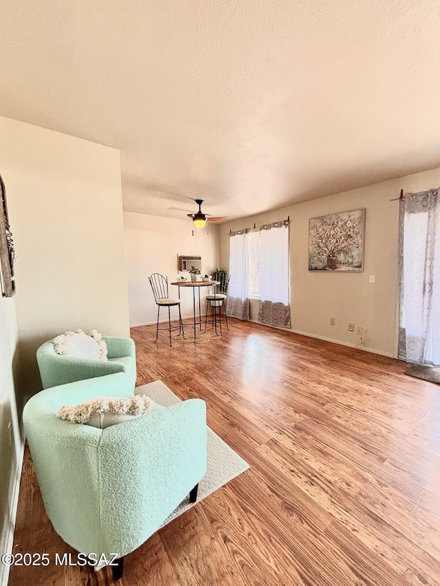 9756 E 32nd St, Tucson, AZ 85748 - living area featuring wood finished floors and a ceiling fan