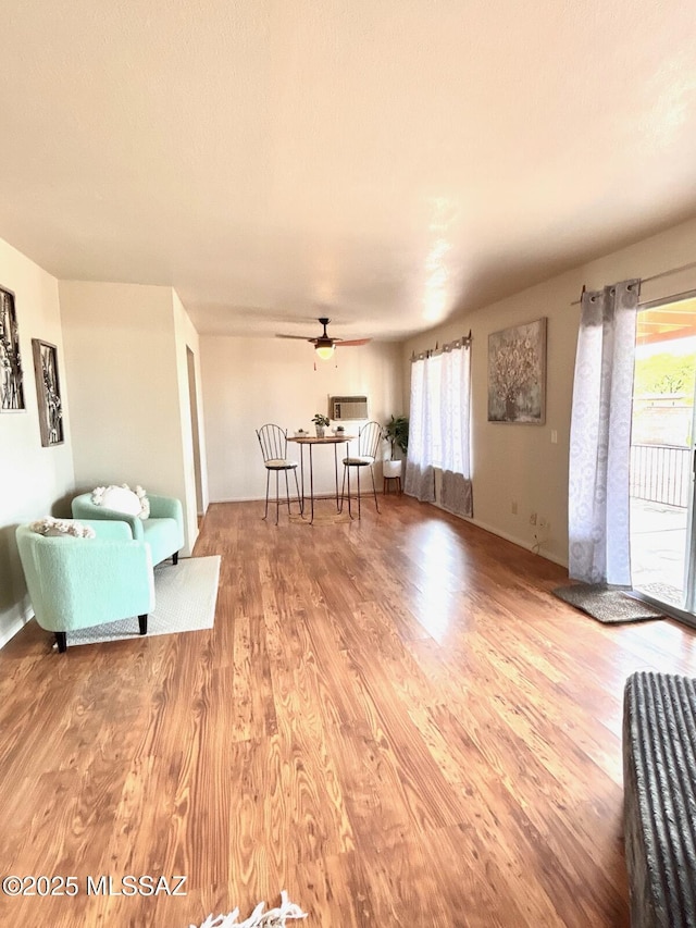 9756 E 32nd St, Tucson, AZ 85748 - living room with wood finished floors and ceiling fan