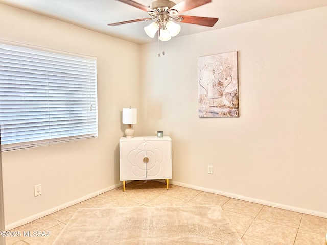 9756 E 32nd St, Tucson, AZ 85748 - spare room with light tile patterned flooring, ceiling fan, and baseboards