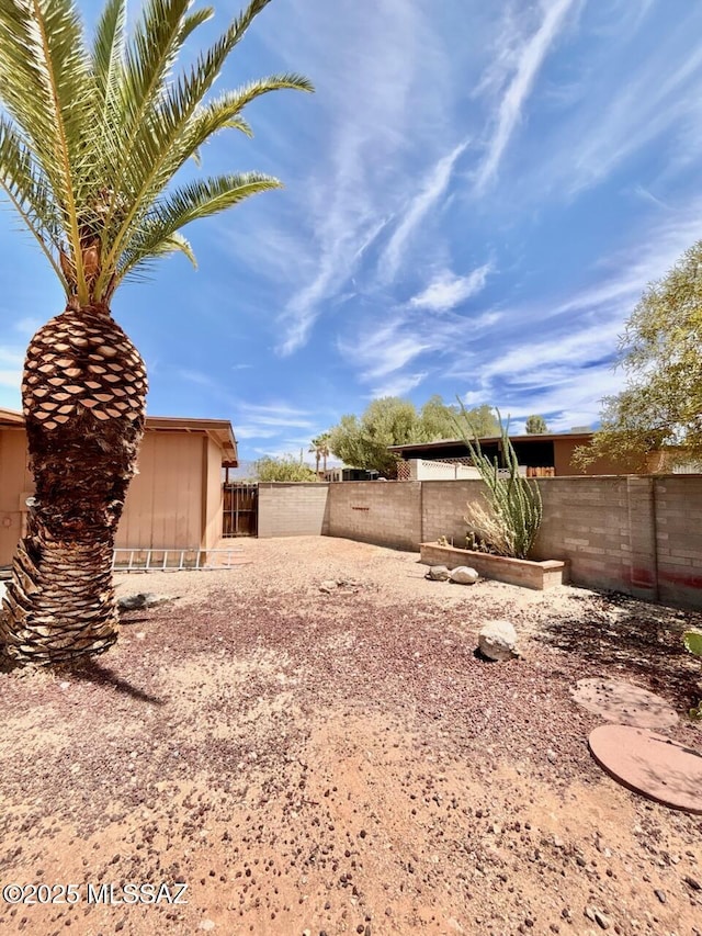 9756 E 32nd St, Tucson, AZ 85748 - fenced backyard with a storage shed
