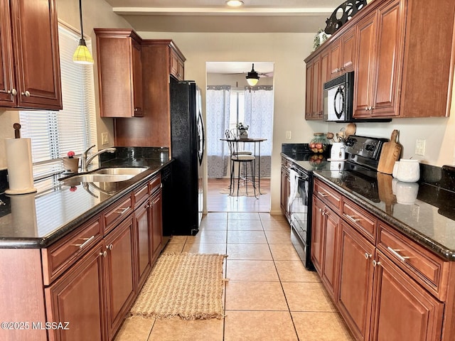 9756 E 32nd St, Tucson, AZ 85748 - kitchen with black appliances, a sink, ceiling fan, light tile patterned flooring, and decorative light fixtures