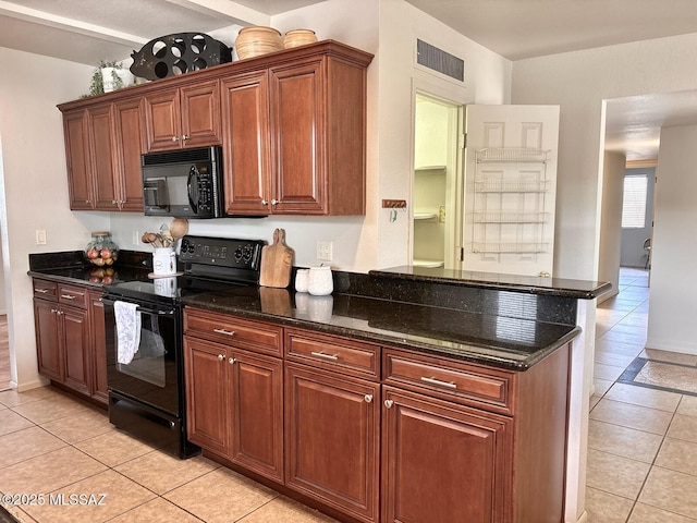 9756 E 32nd St, Tucson, AZ 85748 - kitchen featuring black appliances, light tile patterned flooring, dark stone countertops, and a peninsula