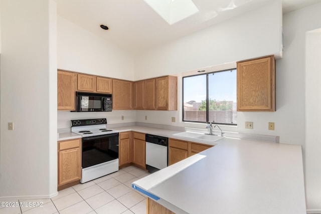 3252 W Flowering Cactus Ct, Tucson, AZ 85745 - kitchen with electric range, dishwasher, black microwave, a sink, and a skylight