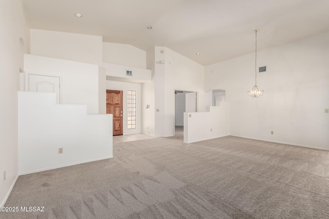 3252 W Flowering Cactus Ct, Tucson, AZ 85745 - spare room featuring light carpet, a chandelier, high vaulted ceiling, baseboards, and recessed lighting