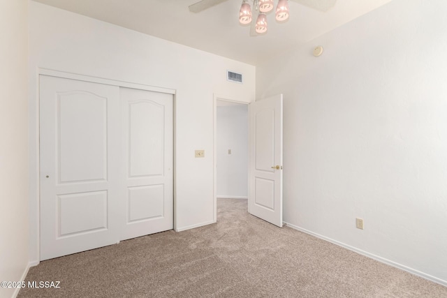 3252 W Flowering Cactus Ct, Tucson, AZ 85745 - unfurnished bedroom with carpet floors, a closet, baseboards, and a ceiling fan