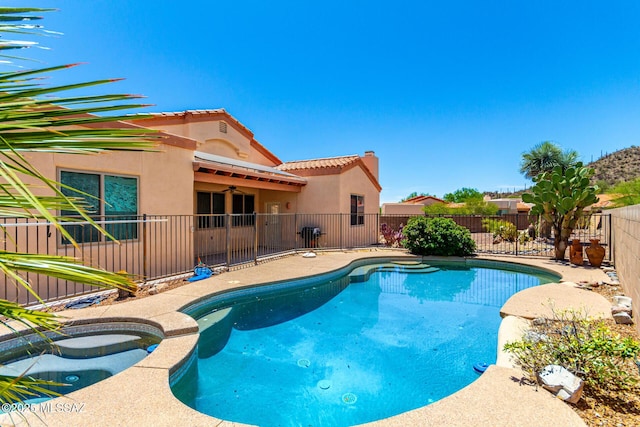 3252 W Flowering Cactus Ct, Tucson, AZ 85745 - view of pool featuring a fenced backyard, a pool with connected hot tub, and ceiling fan
