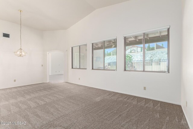 3252 W Flowering Cactus Ct, Tucson, AZ 85745 - carpeted empty room featuring lofted ceiling, arched walkways, a chandelier, and baseboards