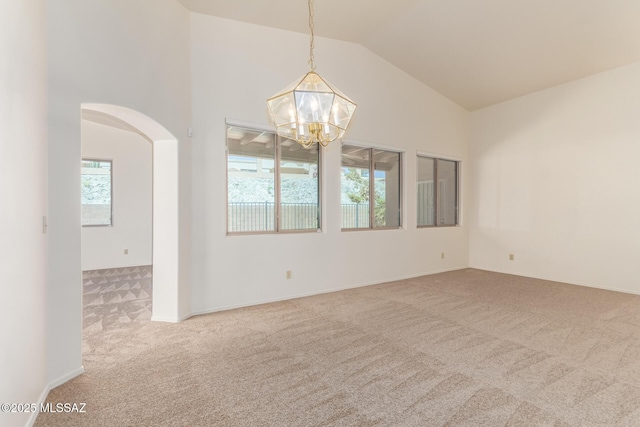 3252 W Flowering Cactus Ct, Tucson, AZ 85745 - carpeted empty room with a chandelier, arched walkways, and lofted ceiling