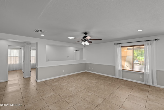 6945 S Wingbow Dr, Tucson, AZ 85756 - empty room featuring light tile patterned floors, a ceiling fan, plenty of natural light, recessed lighting, and a textured ceiling