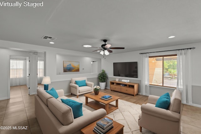 6945 S Wingbow Dr, Tucson, AZ 85756 - living area with recessed lighting, healthy amount of natural light, ceiling fan, and baseboards