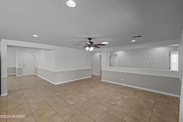 6945 S Wingbow Dr, Tucson, AZ 85756 - empty room with light tile patterned floors, a ceiling fan, recessed lighting, and baseboards