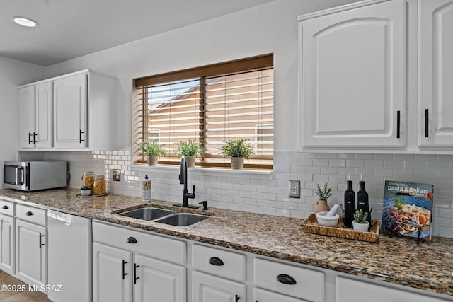 6945 S Wingbow Dr, Tucson, AZ 85756 - kitchen with dishwasher, stainless steel microwave, a sink, and white cabinetry