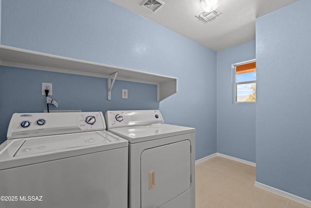 6945 S Wingbow Dr, Tucson, AZ 85756 - washroom featuring washer and clothes dryer, baseboards, and light floors