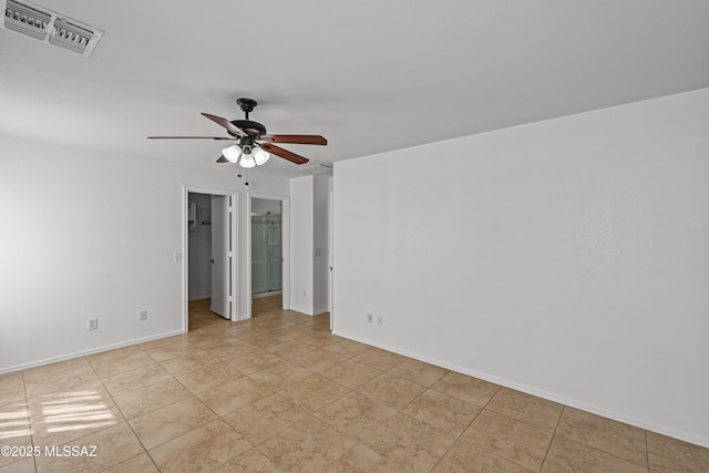 6945 S Wingbow Dr, Tucson, AZ 85756 - unfurnished room featuring a ceiling fan, baseboards, and light tile patterned flooring