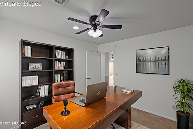 6945 S Wingbow Dr, Tucson, AZ 85756 - office area featuring a ceiling fan, baseboards, and light tile patterned flooring