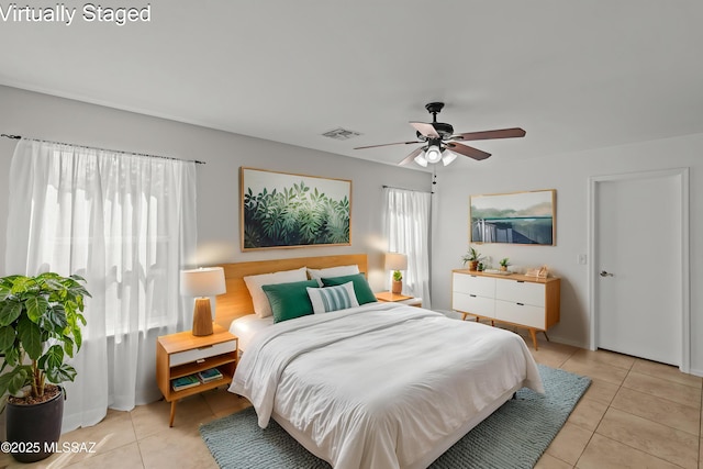 6945 S Wingbow Dr, Tucson, AZ 85756 - bedroom with light tile patterned flooring and a ceiling fan