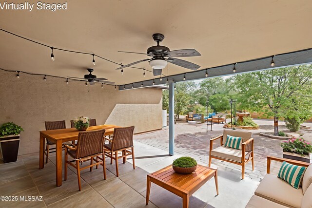 6945 S Wingbow Dr, Tucson, AZ 85756 - view of patio featuring an outdoor living space, a ceiling fan, and outdoor dining space