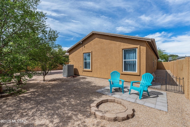 6945 S Wingbow Dr, Tucson, AZ 85756 - back of house with central air condition unit, a patio area, a fenced backyard, and stucco siding