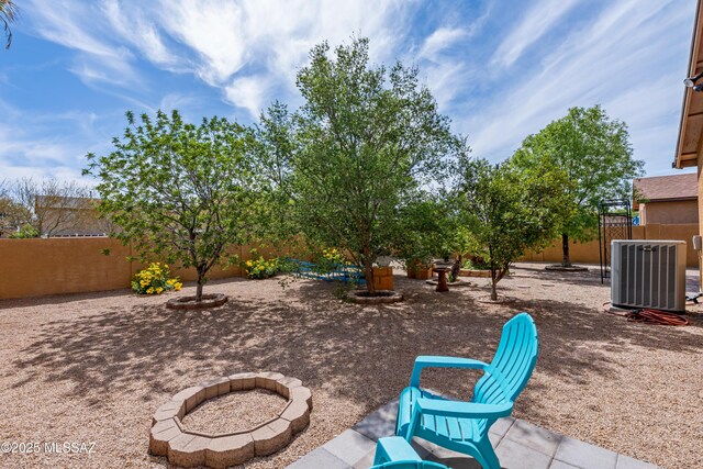 6945 S Wingbow Dr, Tucson, AZ 85756 - fenced backyard with central AC unit and a patio area