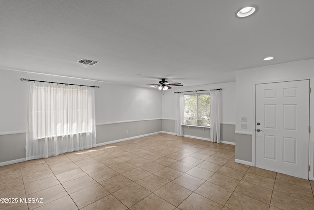 6945 S Wingbow Dr, Tucson, AZ 85756 - spare room featuring light tile patterned floors, ceiling fan, recessed lighting, and baseboards