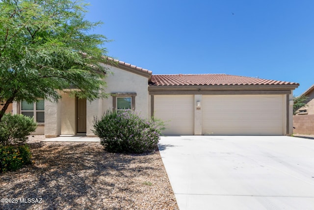 854 S Willis Ave, Vail, AZ 85641 - mediterranean / spanish house with stucco siding, an attached garage, concrete driveway, and a tiled roof