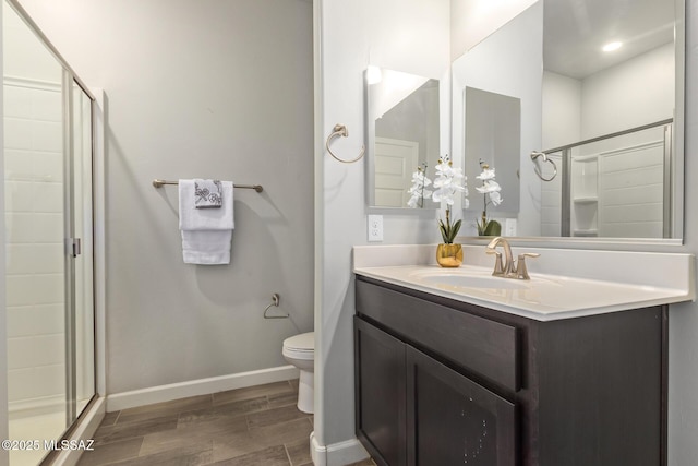 854 S Willis Ave, Vail, AZ 85641 - full bath featuring wood finished floors, a stall shower, vanity, toilet, and baseboards