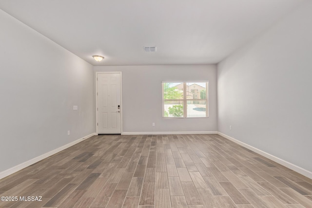 854 S Willis Ave, Vail, AZ 85641 - unfurnished room featuring wood finished floors and baseboards
