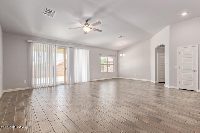 854 S Willis Ave, Vail, AZ 85641 - empty room featuring a ceiling fan, wood finished floors, lofted ceiling, baseboards, and arched walkways